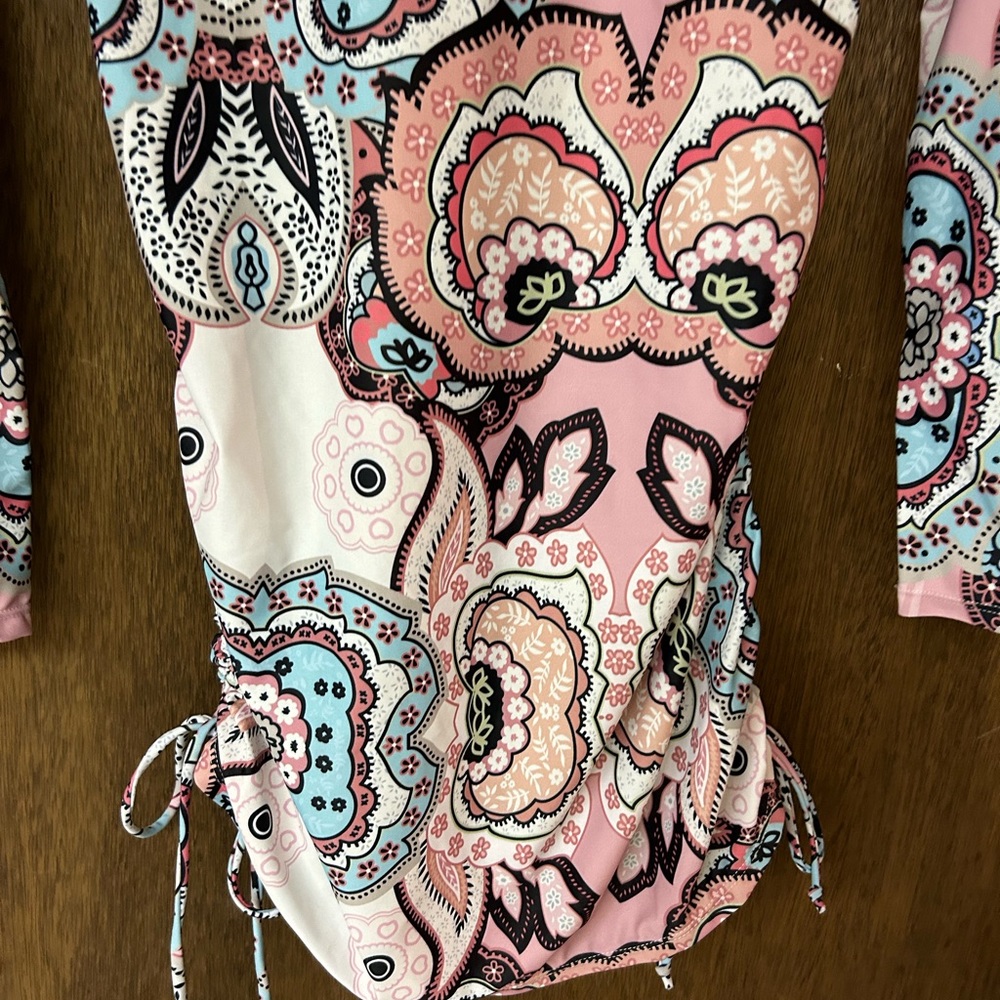 Rash guard has never been worn brand. New tags have just been removed. - Picture 3 of 4